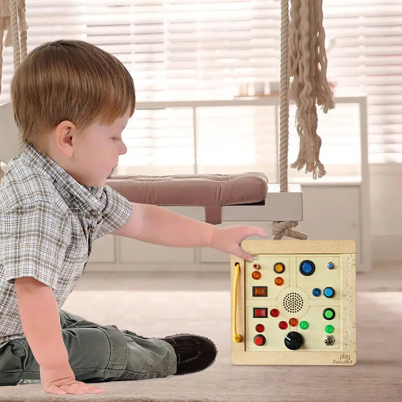 Toddler playing with Busy Buttons Light Board